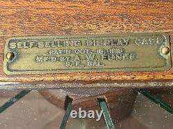 ANTIQUE SELF SELLING STORE COUNTER ROTATING CANDY DISPLAY CASE dated 1918