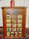 Antique L. L. May country store seed display case cabinet with product-15639