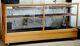Solid Oak antique store display case with plate glass top, orig front, and sides