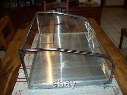 Stainless Steel Store Display Case Has Curved Front Glass